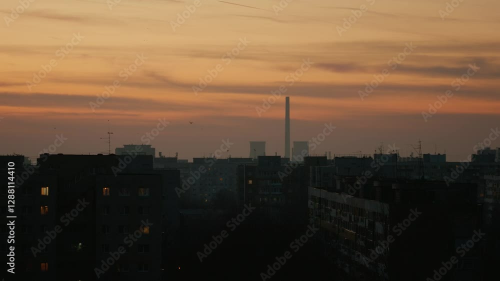 A stunning view of a cityscape during sunset, showcasing rooftop buildings silhouetted against the colorful sky. The vibrant hues create a breathtaking atmosphere. A stunning view of a cityscape during sunset, showcasing rooftop buildings silhouetted against the colorful sky. The vibrant hues create a breathtaking atmosphere.