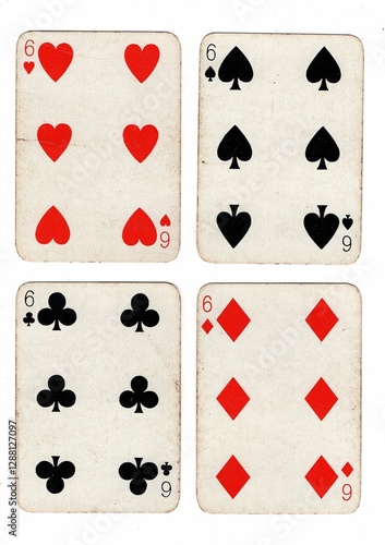 Canvas Print A hand of vintage playing cards showing four of the same value on a white background