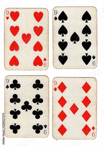 Photography A hand of vintage playing cards showing four of the same value on a white background