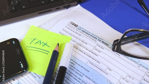 Accountant preparing tax form 1040 for tax season 2025