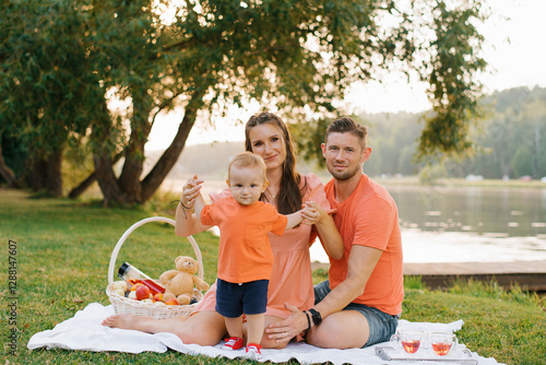 Happy Family Picnic By The Lake