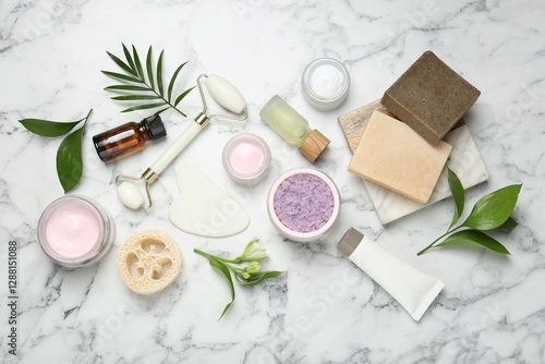 Wallpaper Mural Flat lay composition with different body care products and flowers on white marble table Torontodigital.ca