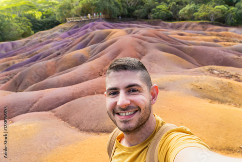 Tourist taking a selfie at the seven coloured earths of chamarel in mauritius island photo