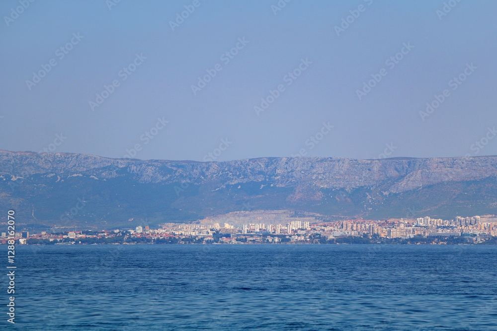 Contemporary buildings, gardens and beaches at the waterfront in Split, Croatia. View of Split from the boat. Contemporary buildings, gardens and beaches at the waterfront in Split, Croatia. View of Split from the boat.