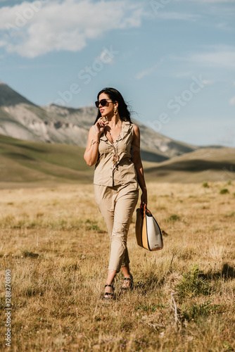 fashion woman walking in the nature 
