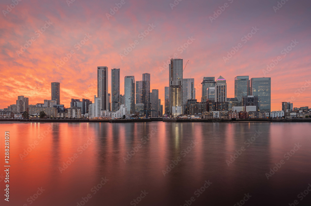 Canary Wharf shot from the Greenwich peninsula during a beautiful sunset and slack tide, creating a gorgeous image. Canary Wharf shot from the Greenwich peninsula during a beautiful sunset and slack tide, creating a gorgeous image.