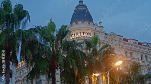 Cannes, France. The illuminated facade of the Carlton Hotel on the Cannes waterfront in the evening