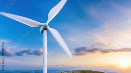 A wind turbine stands tall against a vibrant sky, capturing renewable energy as the sun sets on the horizon.