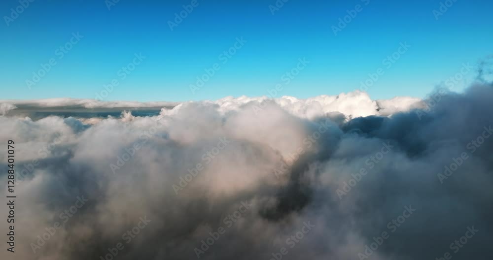 Soft clouds stretch across endless blue sky. Sunlight casts gentle shadows over billowing formations, creating dreamlike aerial scene. Vast atmosphere unfolds in breathtaking skyward Aerial view. Trav Soft clouds stretch across endless blue sky. Sunlight casts gentle shadows over billowing formations, creating dreamlike aerial scene. Vast atmosphere unfolds in breathtaking skyward Aerial view. Trav