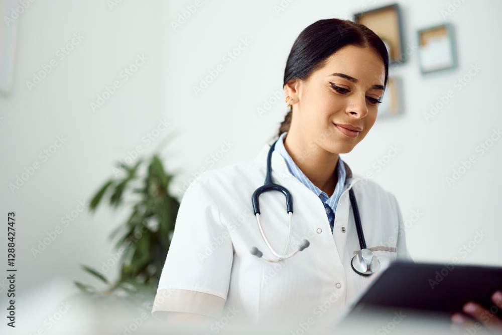 Professional Female Doctor Examining Patient Records in Modern Clinic Environment Professional Female Doctor Examining Patient Records in Modern Clinic Environment