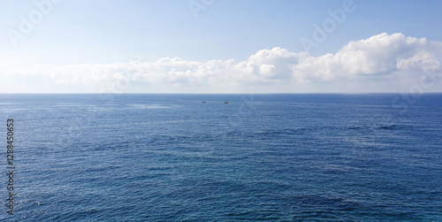 Blue sky and sea beach on the rock coast.