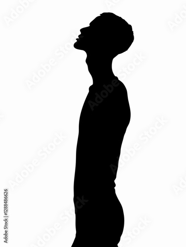 Man is standing in a white background. He is wearing a black shirt and is looking up. The image has a somber and contemplative mood