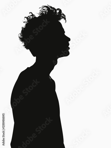 Man with a messy haircut is standing in front of a white background. The image has a moody and edgy feel to it, with the man's unkempt hair and the contrast between his dark silhouette