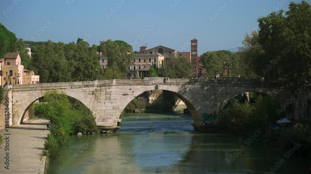 The Pons Cestius, Latin for Cestian Bridge, Italian Ponte Cestio is an ancient Roman bridge in Rome, Italy in summer on sunny day. Ponte Cestio connects Tiber Island to the historic Rione Trastevere. The Pons Cestius, Latin for Cestian Bridge, Italian Ponte Cestio is an ancient Roman bridge in Rome, Italy in summer on sunny day. Ponte Cestio connects Tiber Island to the historic Rione Trastevere.