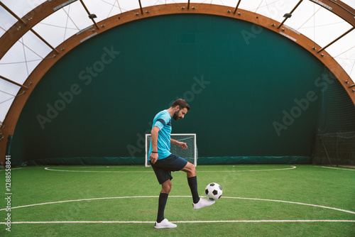 Cinematic image of a soccer freestyle player making tricks with the ball.