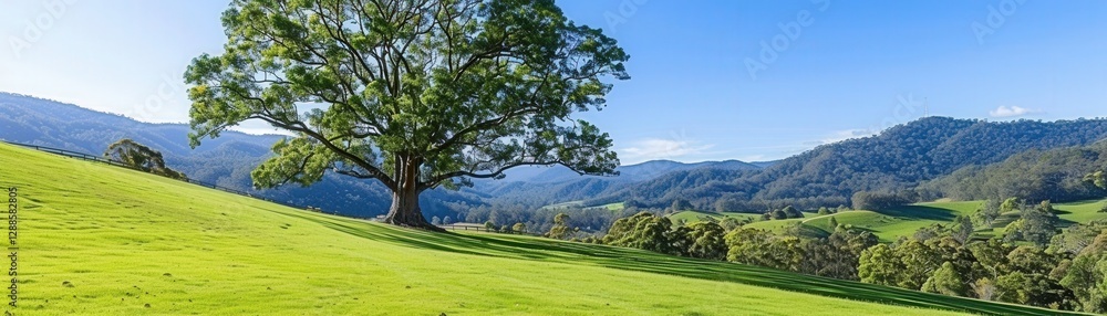 A serene landscape featuring a large tree on a lush green hillside with mountains in the background under a clear blue sky. A serene landscape featuring a large tree on a lush green hillside with mountains in the background under a clear blue sky.