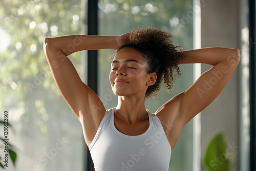 Free Download Young woman stretching with closed eyes, enjoying a moment of relaxation and positivity - GFXLoad