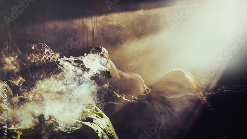 Mysterious light streaming through an old window in a mountain hut at sunrise, the light shines on a woman holding incense