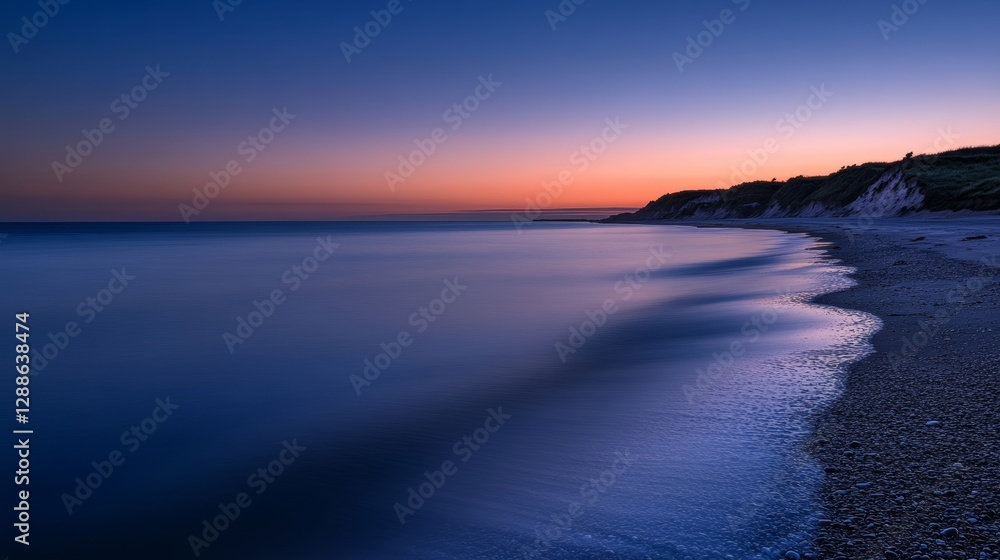 Obraz premium Tranquil Dunes: Dawn on a Pebble Beach Coast