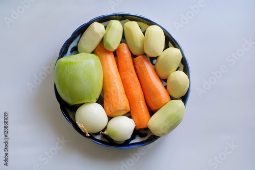 Wallpaper Mural peeled vegetables: potatoes, carrots, radish, and onions lying in a blue bowl. Torontodigital.ca