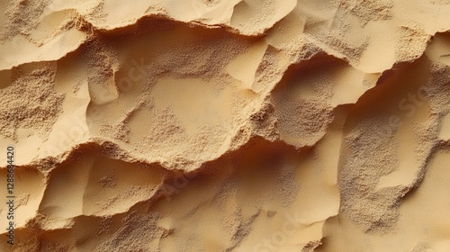 A close up view shows desert sand with undulating surface