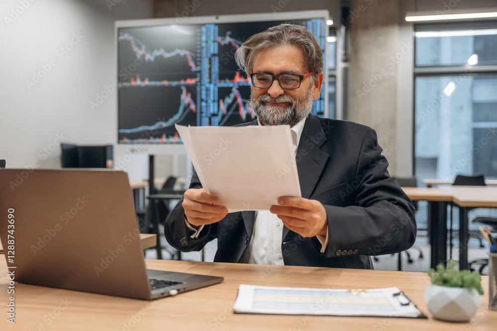 Senior man is in the modern office Senior man is in the modern office
