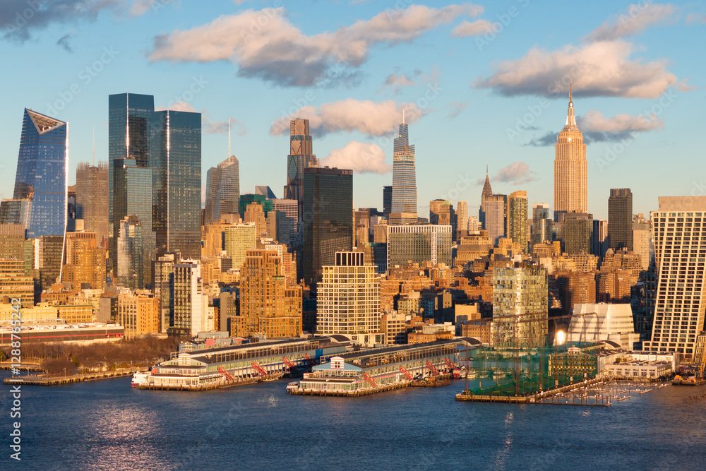 Fototapeta premium Aerial view of New York City skyline with Hudson River Park and Manhattan skyscrapers. The urban landscape includes Midtown high-rise buildings and Chelsea Piers