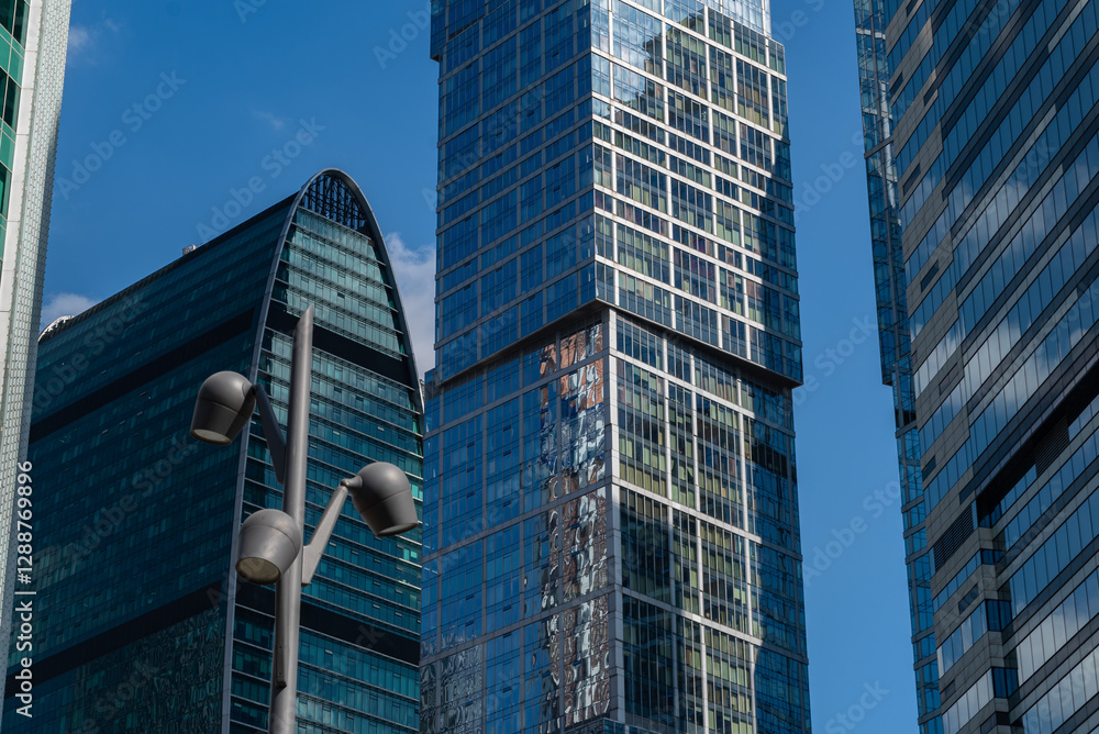 Fototapeta premium City skyscraper district. Business district. Modern city. Glass skyscrapers. Corporate real estate. Russia. Skyscrapers in the center of Moscow. High-rise buildings in the capital of Russia.