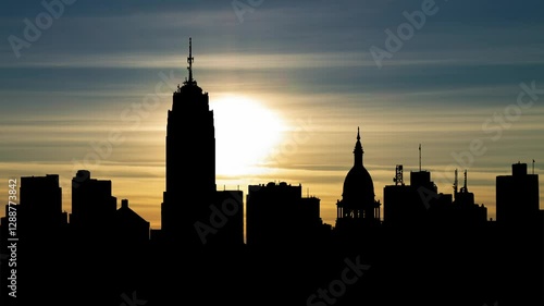 USA: The skyline of Lansing, Michigan. Time Lapse at Sunset with Colorful Clouds