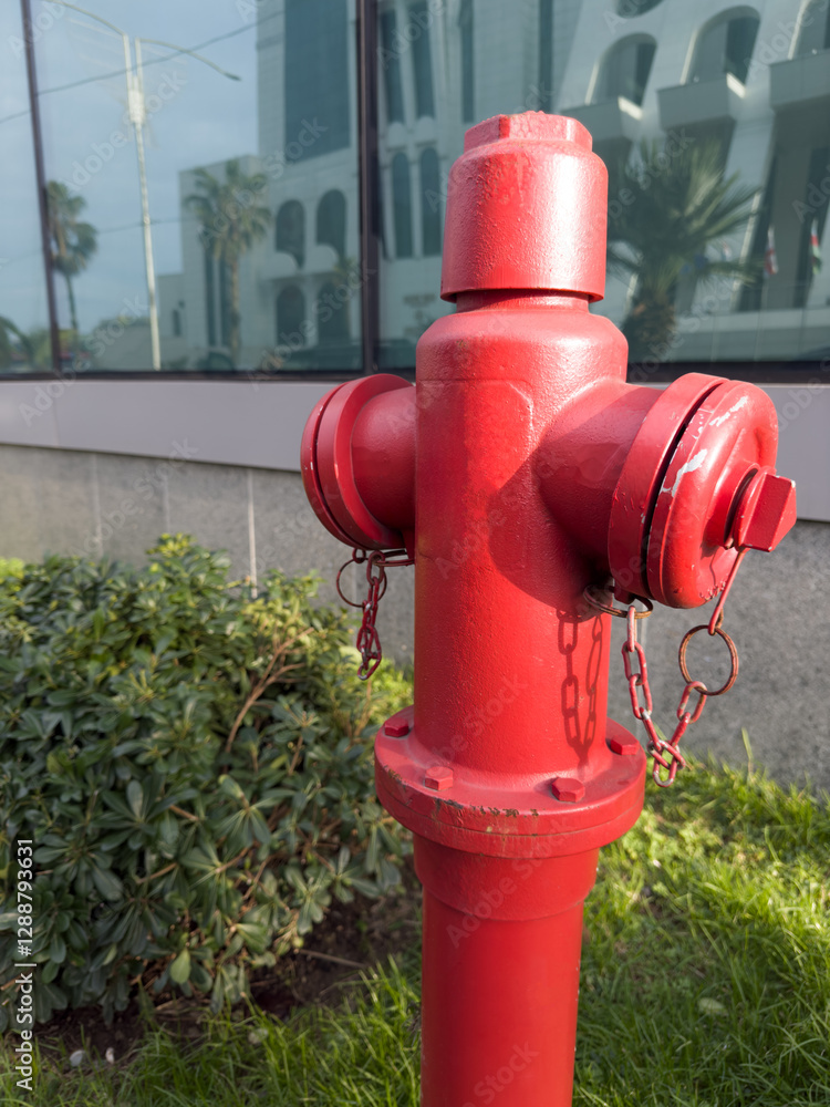 Vertical photo of red fire hydrant for people safety Vertical photo of red fire hydrant for people safety