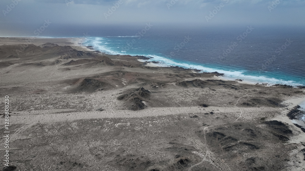 Stunning Socotra coastline showcasing unique desert landscape and vibrant blue ocean waves Stunning Socotra coastline showcasing unique desert landscape and vibrant blue ocean waves