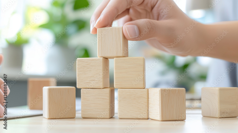 Building tower with wooden blocks, showcasing creativity and focus Building tower with wooden blocks, showcasing creativity and focus