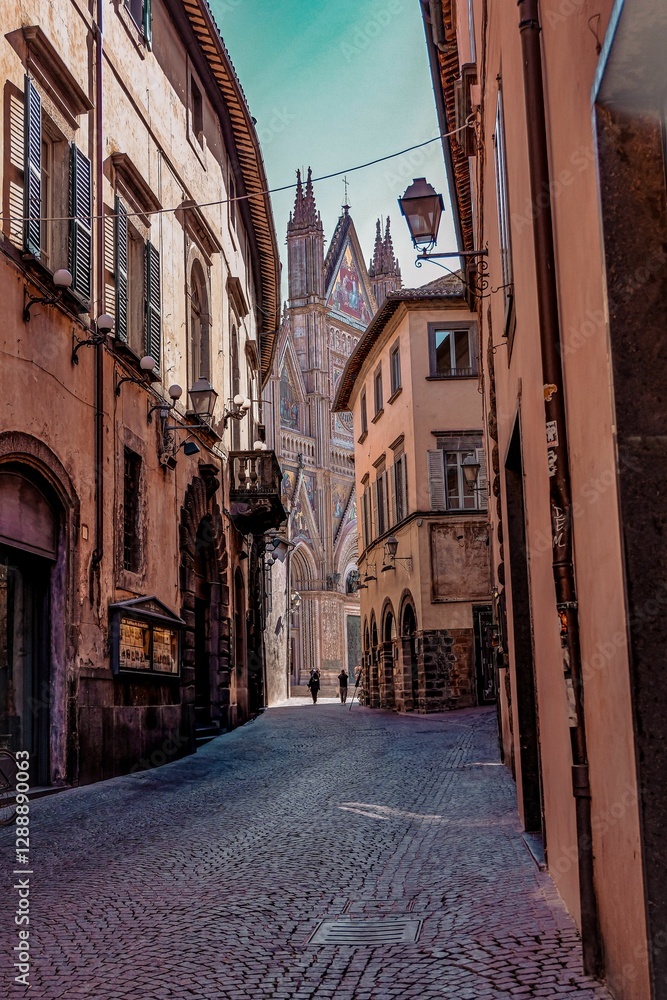 Fototapeta premium Cobblestone street leading to Orvieto Cathedral, Italy.