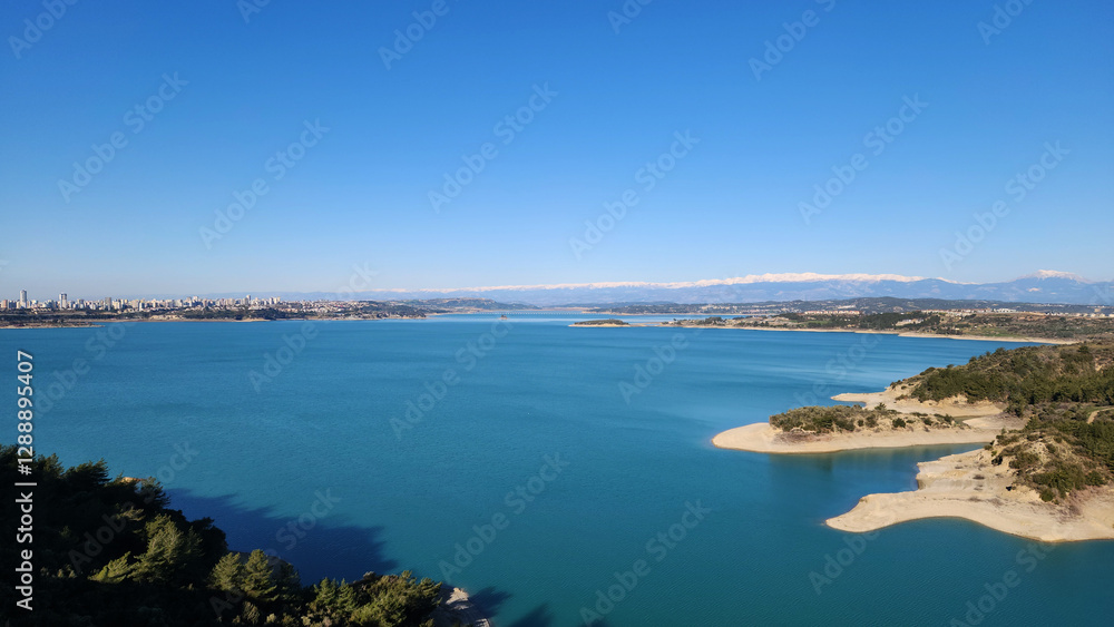 A winter day view of Seyhan Dam Lake from Çukurova University Campus with its impressive turquoise colors A winter day view of Seyhan Dam Lake from Çukurova University Campus with its impressive turquoise colors