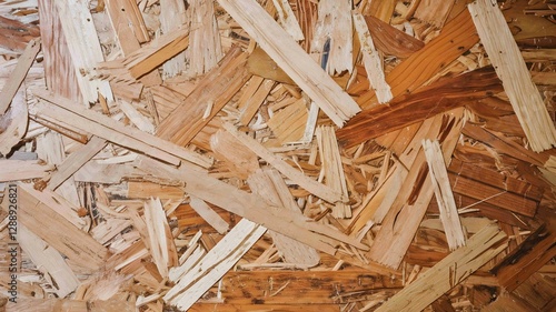 Close Up of Oriented Strand Board (OSB) with Textured Wooden Strands in a Natural Brown Hue and Layered Pattern