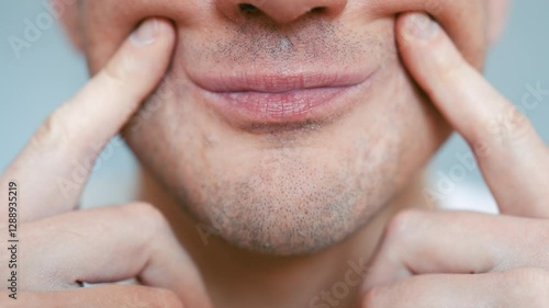 Man Forcing Smile Close-up - Male Using Fingers to Turn Frown into Smile - Concept of Fake Happiness and Emotional Struggle - Mental Health Visual