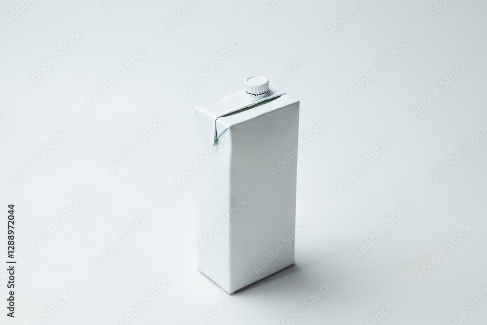 Simple White Milk Carton Placed on a Plain Light Background Simple White Milk Carton Placed on a Plain Light Background