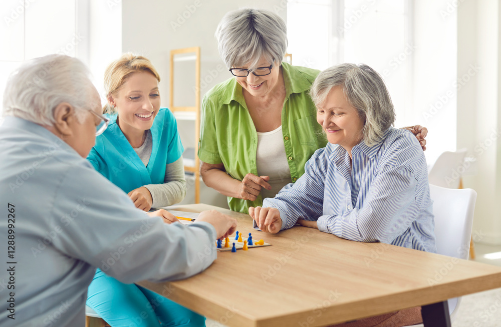 Obraz premium Group of senior people men and women playing board game with a young friendly nurse sitting at the table in nursing home. Pensioners spending leisure time together. Leisure in retirement home.