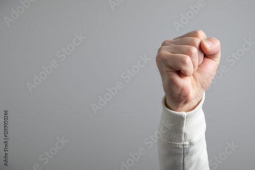 Caucasian angry and aggressive man threatening with fist. photo