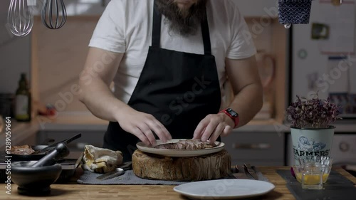 Chef close-up preparing beef with root vegetables. cooking process