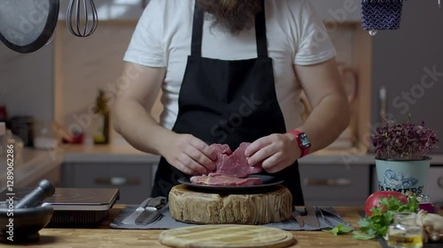 Chef close-up preparing beef with root vegetables. cooking process
