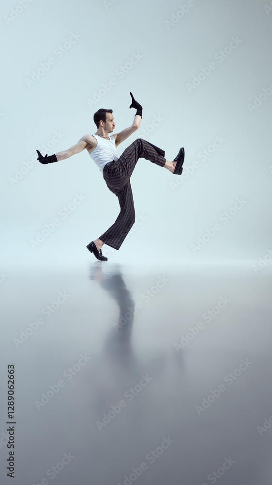 Dynamic performer, dressed stylish attire, leaping mid-air with strong posture and expressive hand moves against white studio background. Concept of beauty and art, fashion and style, self-expression. Dynamic performer, dressed stylish attire, leaping mid-air with strong posture and expressive hand moves against white studio background. Concept of beauty and art, fashion and style, self-expression.