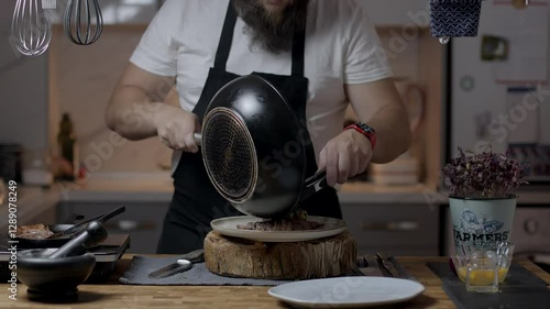 Chef close-up preparing beef with root vegetables. cooking process