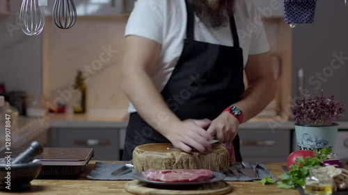 Chef close-up preparing beef with root vegetables. cooking process