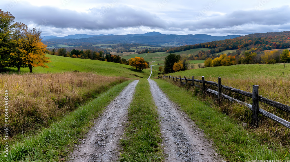 Autumnal country road leads to distant mountains Autumnal country road leads to distant mountains