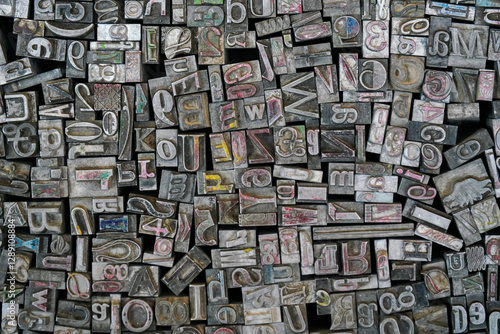 Pile of various metal letter press blocks