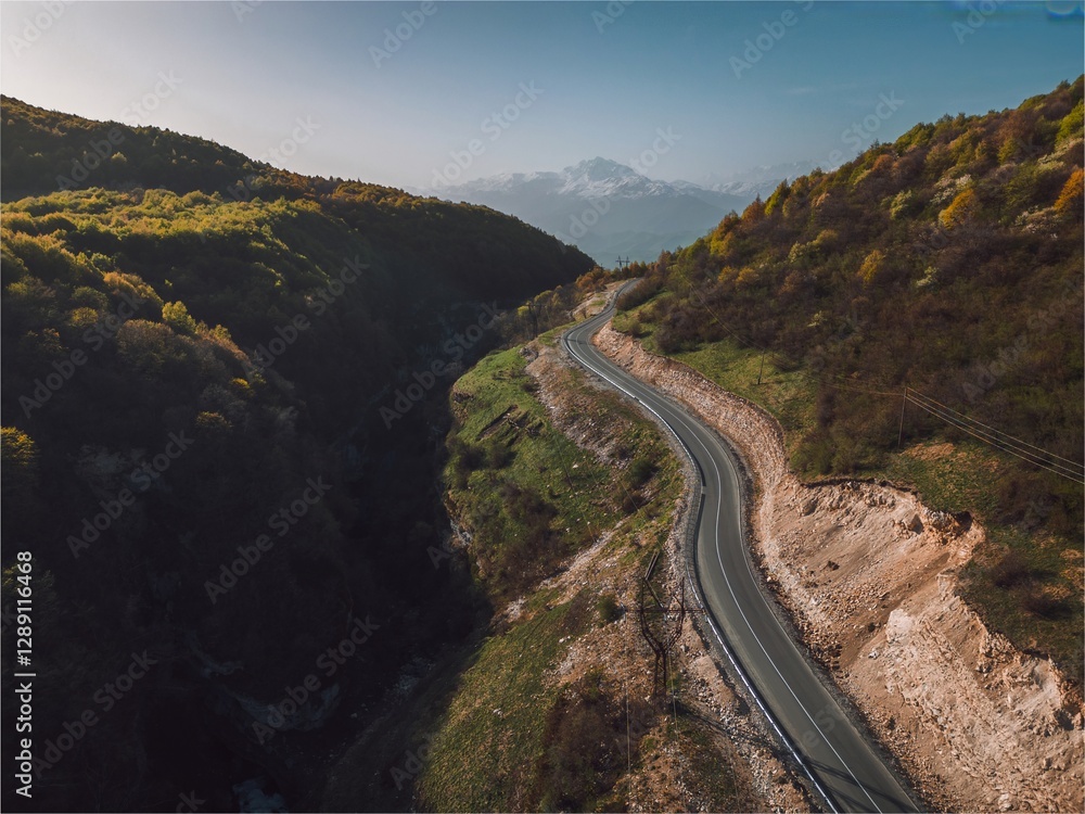 asphalt road through the pass, road high in the mountains, aerial view