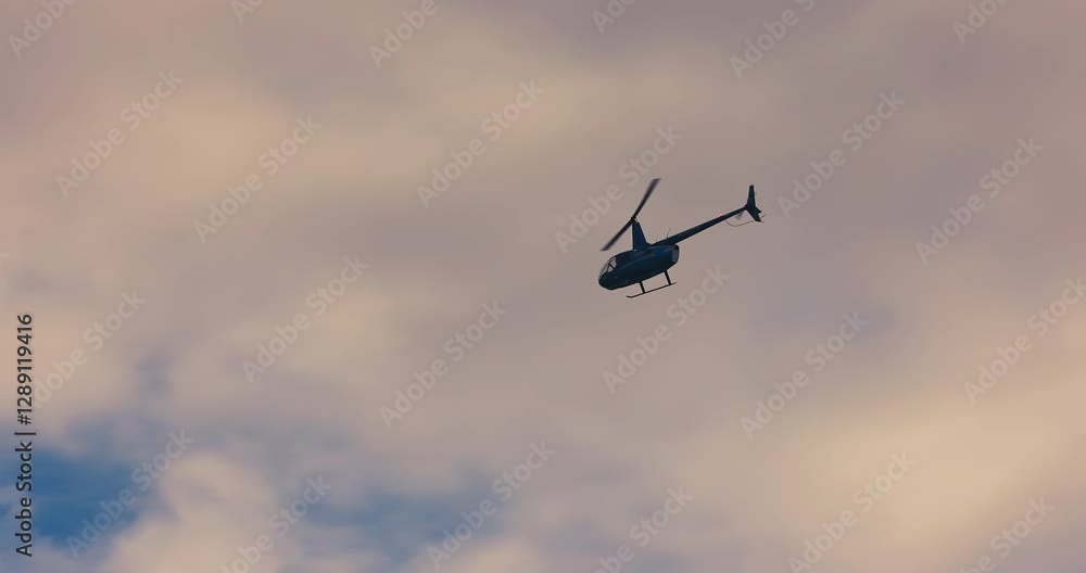 helicopter flying in the foggy sky with clouds helicopter flying in the foggy sky with clouds