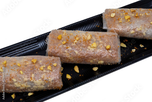 Pootharekulu putharekulu pootarekulu PNG – Famous South Indian Andhra Sweet with Crispy Rice Paper, Jaggery and Nut toppings transparent background