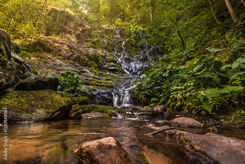 Obraz na płótnie Pilj Waterfall Cascading through Lush Green Forest w salonie
